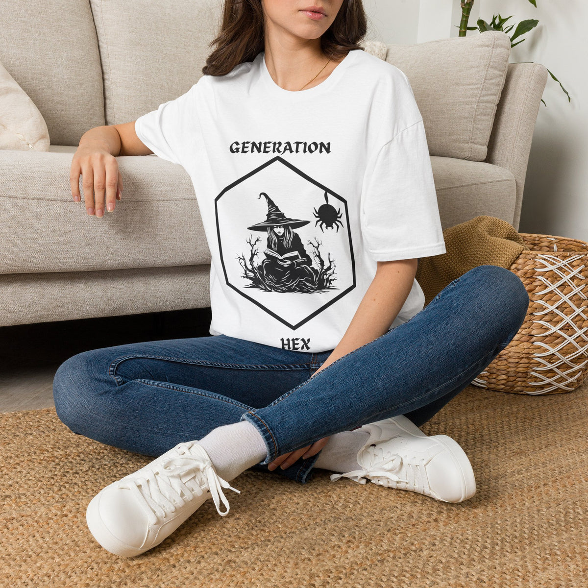 Person wearing a white witch with text 'Generation hex' t-shirt sitting on a couch.